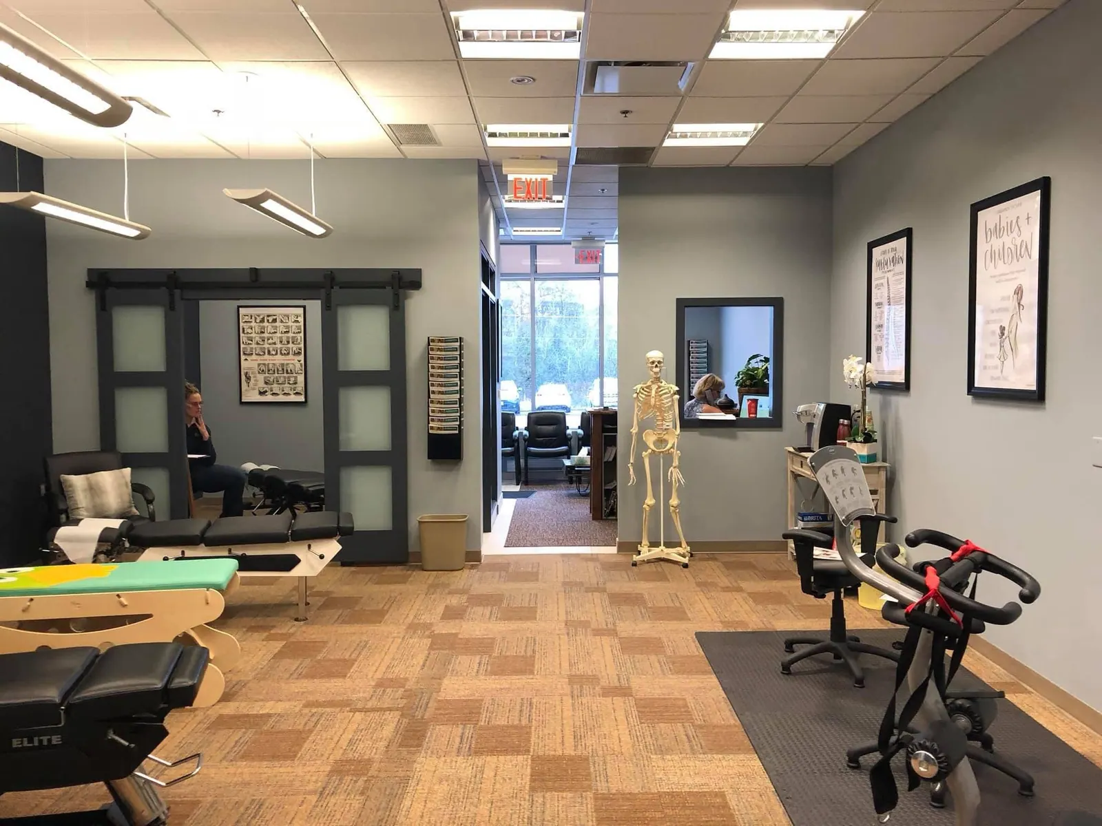 Commercial studio with painted grey walls and green sliding doors